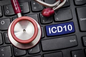 Computer keyboard with ICD 10 on it and a stethoscope